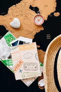 Explore destinations with a compass and passport on a world map. Perfect for adventure planning.